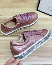 Rosa Glitzersneaker mit Plateausohle, Damenmode, trendige Freizeitschuhe, funkelndes Design.