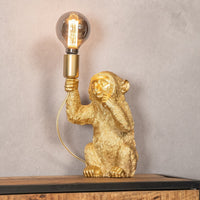 Goldene Affen-Tischlampe, skulpturales Design, Vintage-Glühbirne, dekorative Wohnaccessoires.