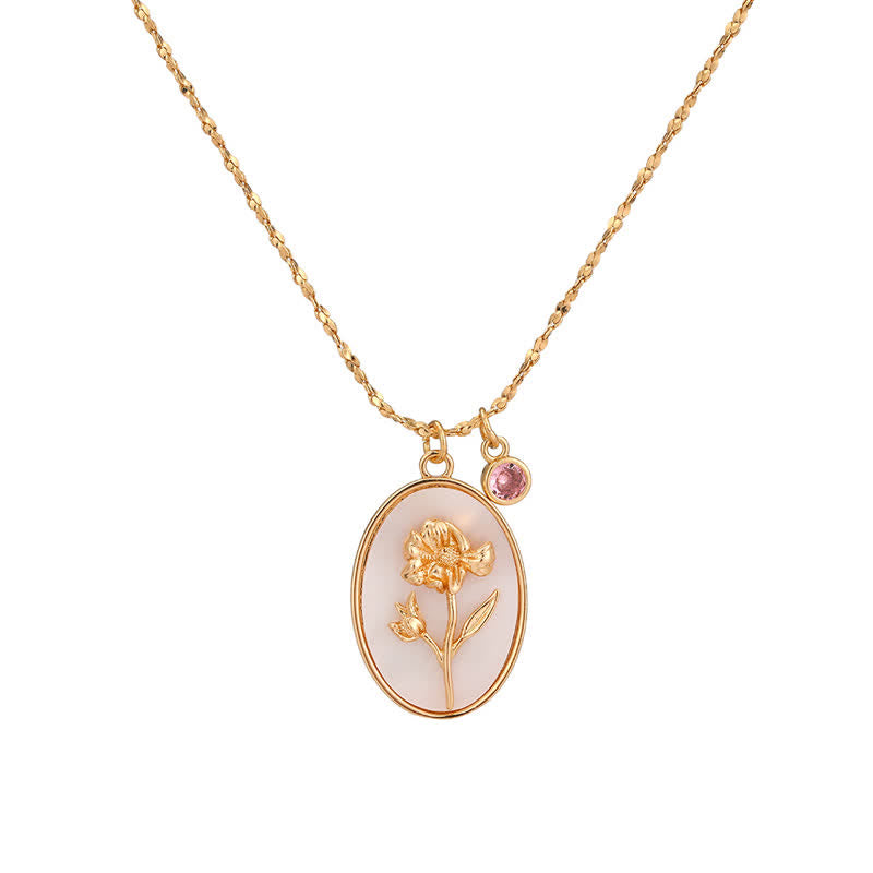Goldene Halskette mit Blumenanhänger und rosa Stein, eleganter Schmuck für Damen.