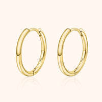 Goldene Creolen Ohrringe, 18 Karat, glänzend, elegantes Design, Schmuck für Damen.