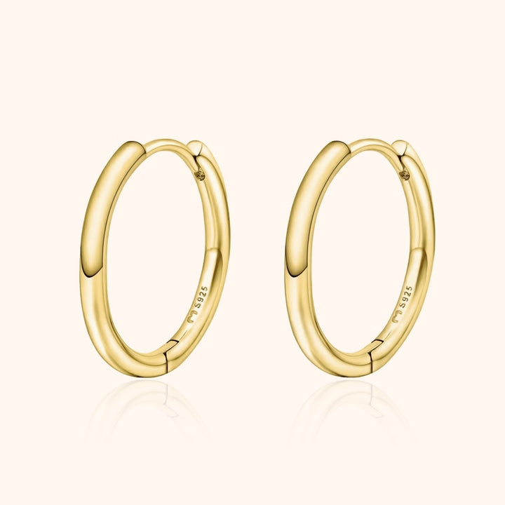 Goldene Creolen Ohrringe, 18 Karat, glänzend, elegantes Design, Schmuck für Damen.