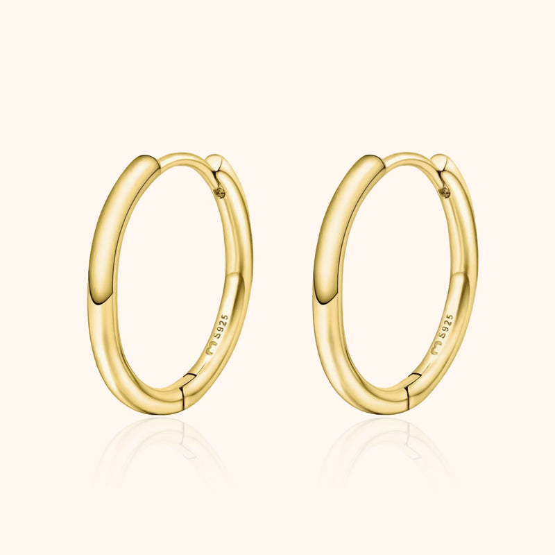 Goldene Creolen Ohrringe, 18 Karat, glänzend, elegantes Design, Schmuck für Damen.