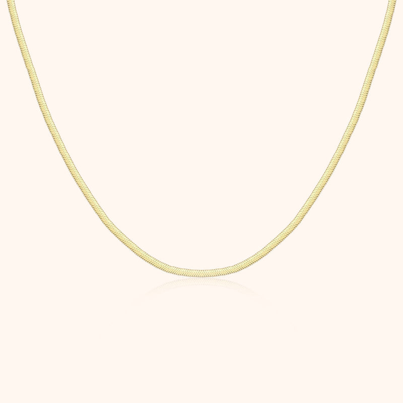 Goldene Schlangenkette, 18 Karat, elegantes Design, Schmuck für Damen, luxuriöses Accessoire.