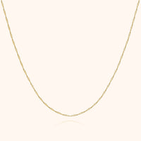 Goldene Halskette, filigranes Design, 14 Karat, eleganter Schmuck für Damen.