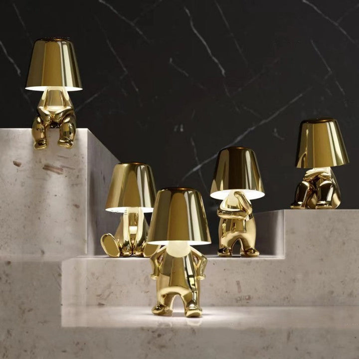 Goldene Tischlampen in Form von Figuren, modernes Design, dekorative Beleuchtung, Wohnzimmer.