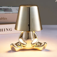 Goldene Tischlampe in Form einer Figur, modernes Design, dekorative Beleuchtung, Metall.