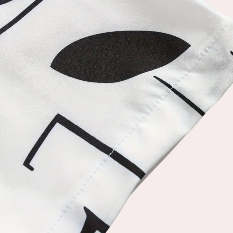 Schwarz-weißes geometrisches Muster auf Stoff, Nahaufnahme, modernes Design, Textilmaterial.