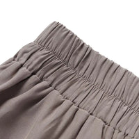 Beige Damenrock mit elastischem Bund, Falten, bequem, modisch, Freizeitkleidung.