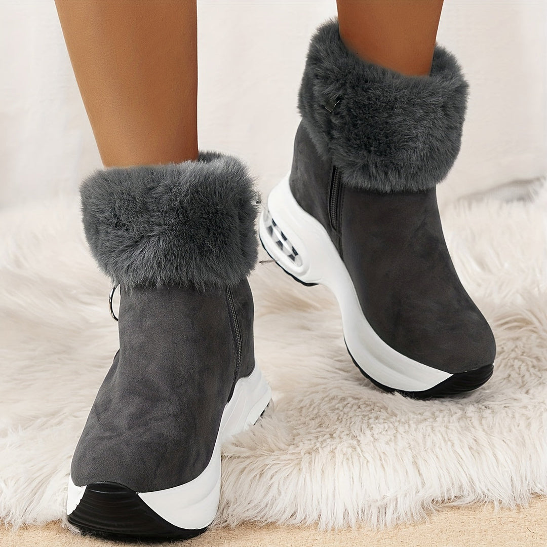 Graue Damen-Winterstiefel mit Fellbesatz, rutschfeste Sohle, modisch und warm.