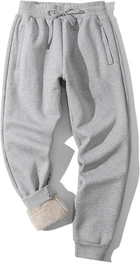 Graue Jogginghose aus Baumwolle mit Kordelzug, warm gefüttert, ideal für Winterkleidung.