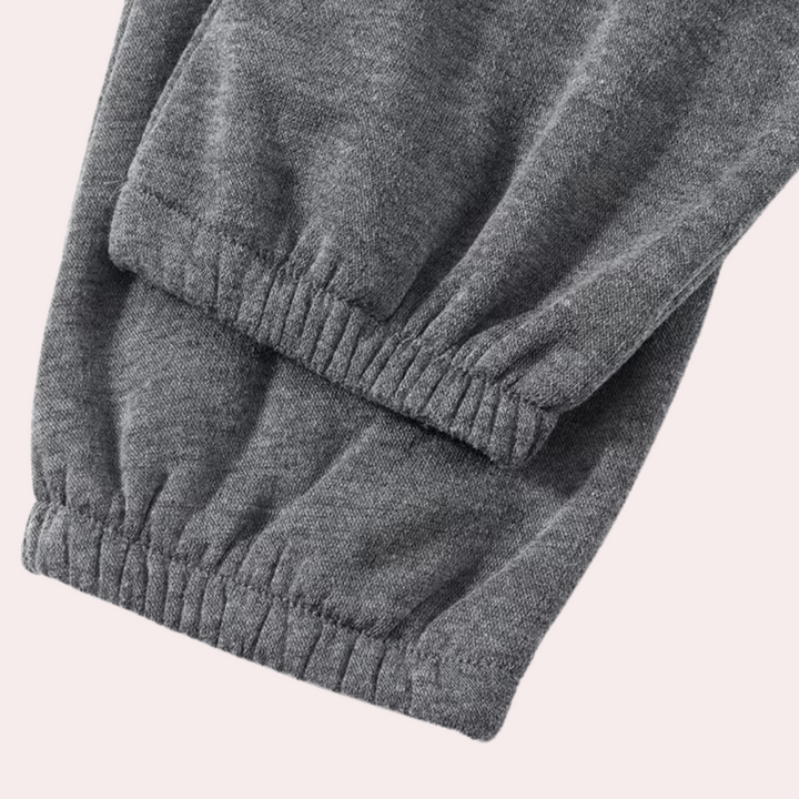 Graue Jogginghose aus Baumwolle, elastische Bündchen, bequeme Sportbekleidung für Damen.