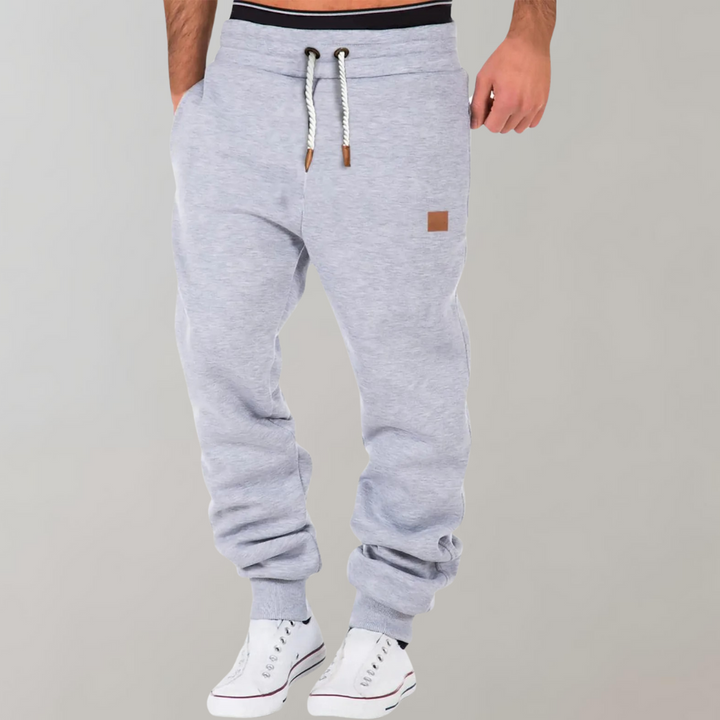 Graue Herren-Jogginghose mit Kordelzug, bequem, sportlich, Baumwolle, Freizeitmode.