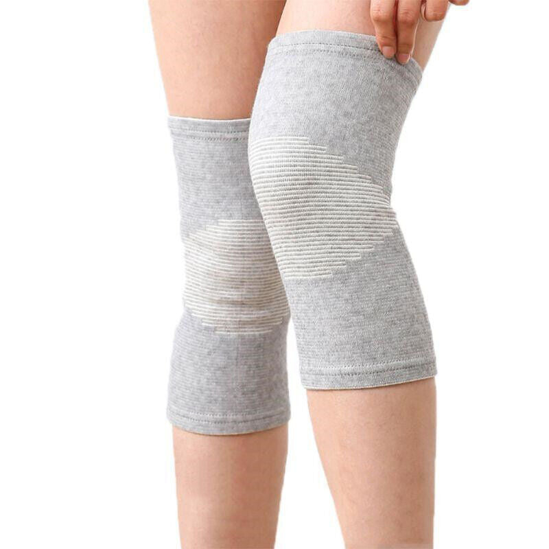 Graue Kniebandage aus Baumwolle für Sport und Unterstützung, elastisch und atmungsaktiv.