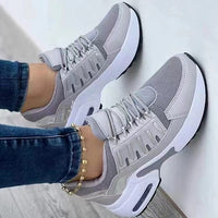 Graue Damen-Sneaker, atmungsaktiv, sportlich, mit weißer Sohle, ideal für Freizeit und Fitness.