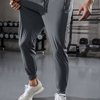 Graue Jogginghose Herren, Sportbekleidung, Fitnessstudio, elastisch, bequem, modern, atmungsaktiv.