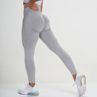 Graue Damen-Sportleggings, nahtlos, hohe Taille, elastisch, ideal für Fitness und Yoga.