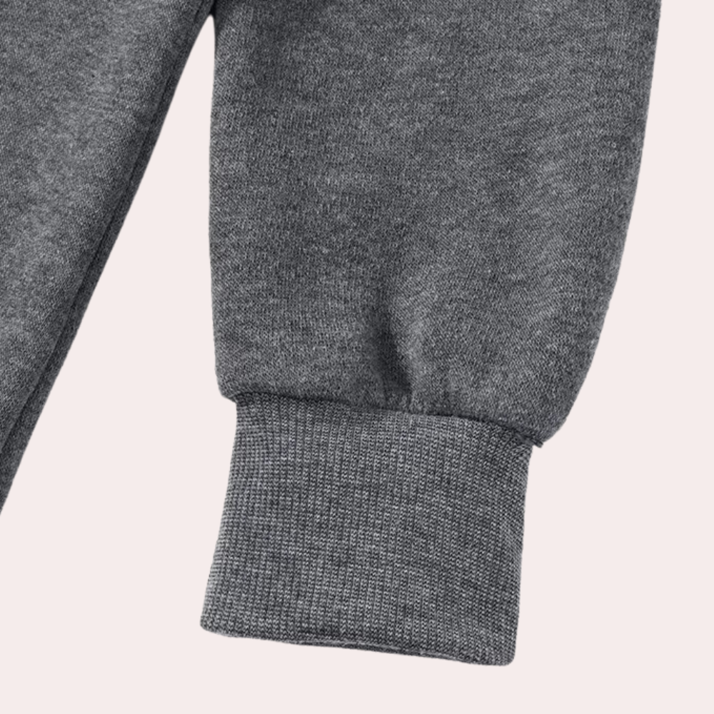 Graue Jogginghose aus Baumwolle, Nahaufnahme, Bündchen, bequem, Freizeitkleidung, Sportmode.