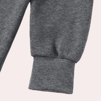 Graue Jogginghose aus Baumwolle, Nahaufnahme, Bündchen, bequem, Freizeitkleidung, Sportmode.