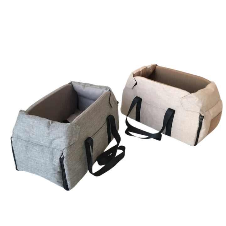 Zwei tragbare Hundetragetaschen, grau und beige, mit schwarzen Griffen, aus robustem Stoff.