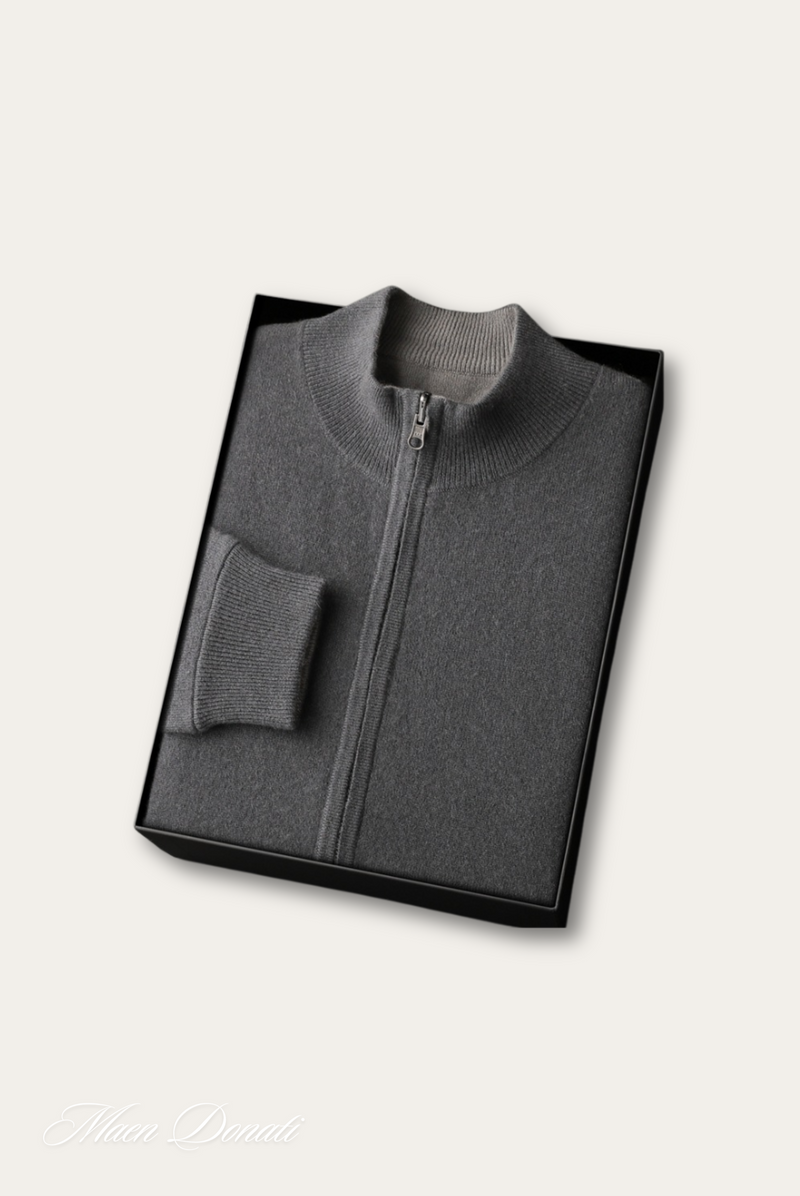 Grauer Kaschmirpullover mit Reißverschluss, gefaltet in schwarzer Geschenkbox, luxuriöse Mode.