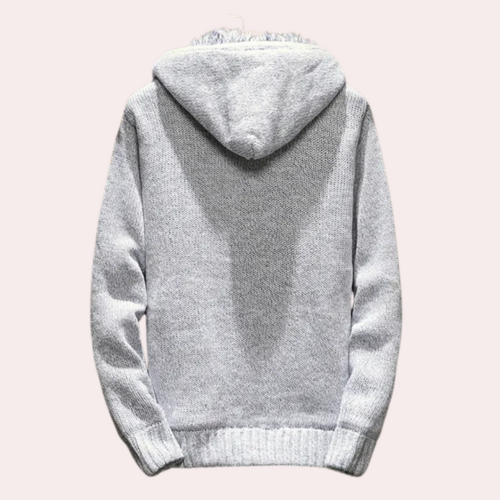 Grauer Kapuzenpullover aus Strickstoff, warm und bequem, ideal für Herbst und Winter.