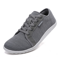 Grauer Sneaker aus Textil mit weißer Sohle, ideal für Alltag und Sport.