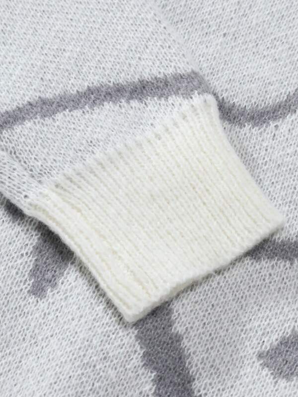 Weißer Strickpullover-Ärmel aus Wolle mit grauem Muster, weiches Wintermode-Design.