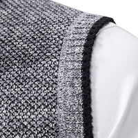 Grauer Strickstoff, Nahaufnahme, Textur, Detailansicht, hochwertige Materialien, Mode, Bekleidung.