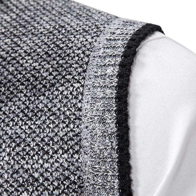 Grauer Strickstoff, Nahaufnahme, Textur, Detailansicht, hochwertige Materialien, Mode, Bekleidung.