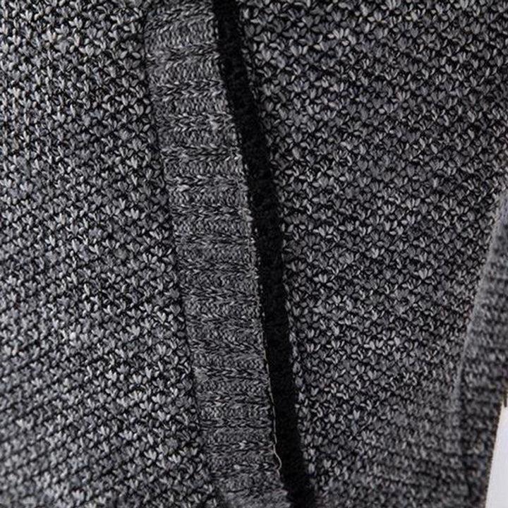 Grauer Strickstoff, Nahaufnahme, Textur, weiches Material, Mode, Bekleidung, Detailansicht.