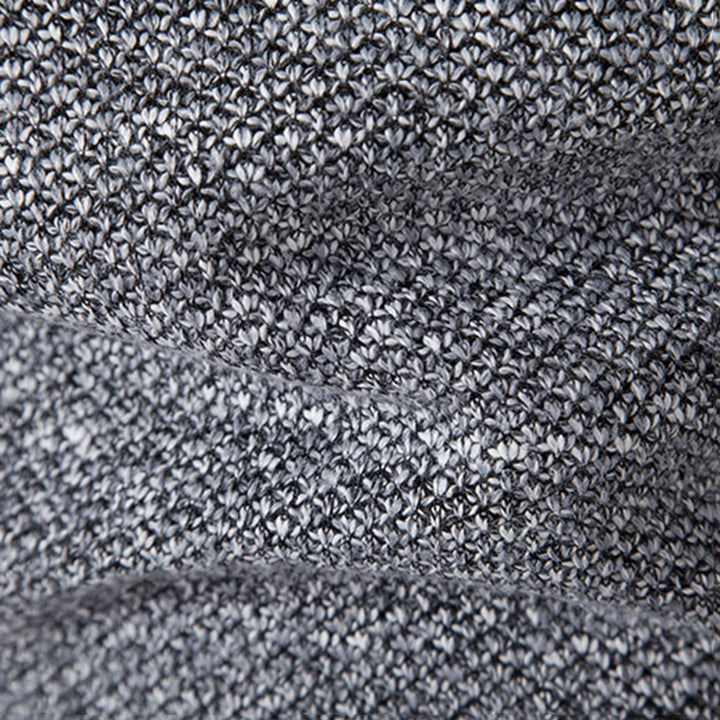 Graues Strickgewebe, Nahaufnahme, Textur, weiches Material, modisch, hochwertig, Detailansicht.