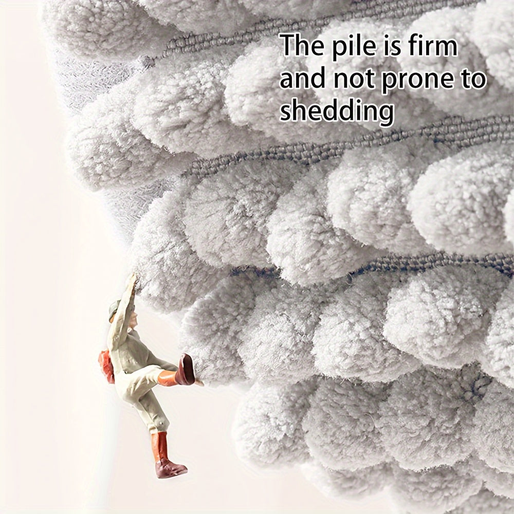 Graues, flauschiges Mikrofaser-Handtuch, fusselfrei, weiche Textur, langlebig.