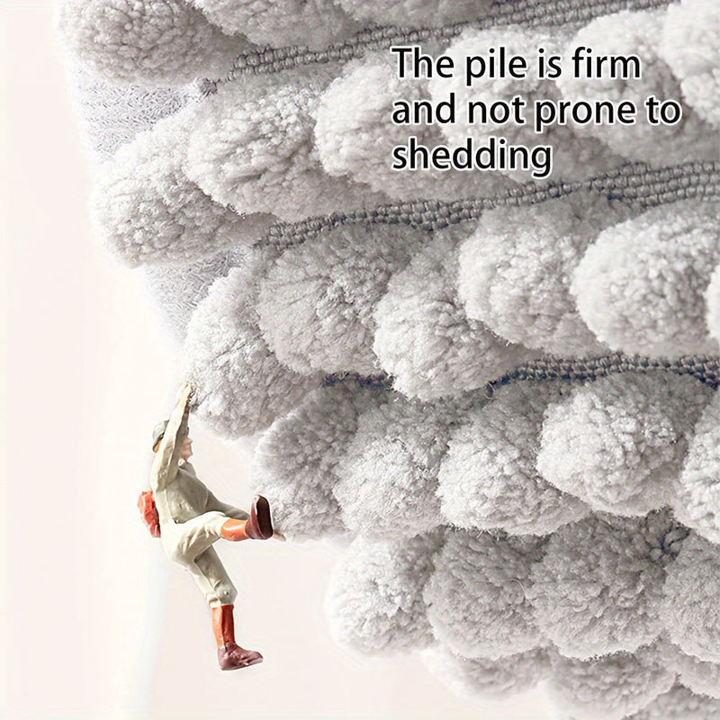 Graues, flauschiges Mikrofaser-Handtuch, fusselfrei, weiche Textur, langlebig.