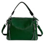 Grüne Lederhandtasche mit Reißverschlüssen, verstellbarem Schulterriemen, modisch, elegant.