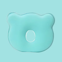 Grünes ergonomisches Babykissen aus Schaumstoff, bärenförmig, zur Kopfunterstützung.