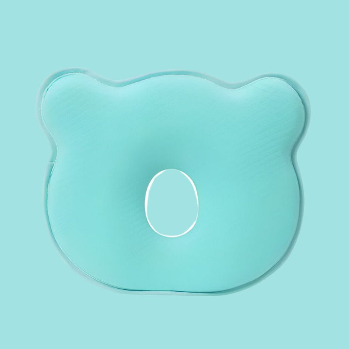 Grünes ergonomisches Babykissen aus Schaumstoff, bärenförmig, zur Kopfunterstützung.