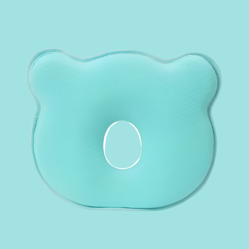 Grünes ergonomisches Babykissen aus Schaumstoff, bärenförmig, zur Kopfunterstützung.