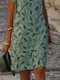 Grünes Kleid mit Blattmuster, Damenmode, Sommerkleidung, elegant, Freizeitkleid.
