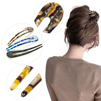 Frau mit braunem Haar, trägt Haarnadel-Set in Schildpatt-Optik, ideal für Hochsteckfrisuren.