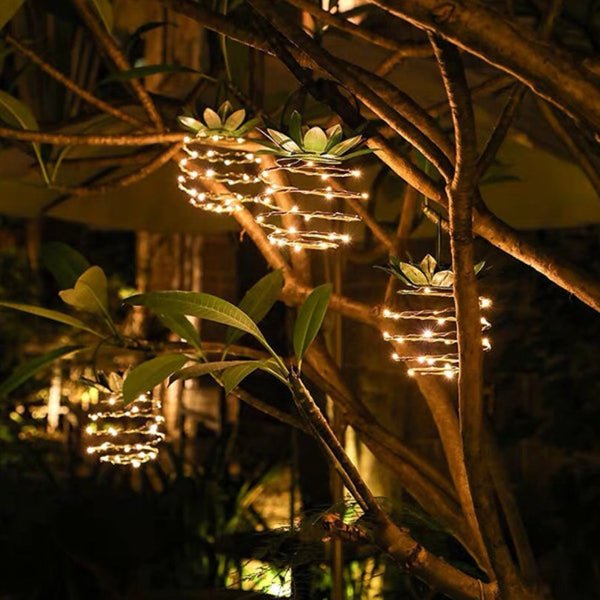 Hängende Ananas-Lichterketten im Garten, LED, dekorativ, warmweiß, Outdoor-Beleuchtung.