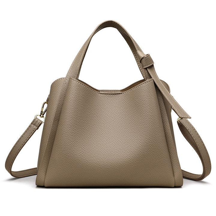 Beige Lederhandtasche mit Schulterriemen, elegantes Design, Damenmode Accessoire.