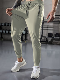 Herren Jogginghose beige, elastisch, mit Kordelzug, ideal für Fitness und Freizeit.