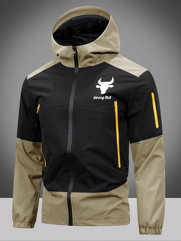 Schwarze und beige Outdoor-Jacke mit Kapuze, gelben Reißverschlüssen, "strong Bull" Logo.