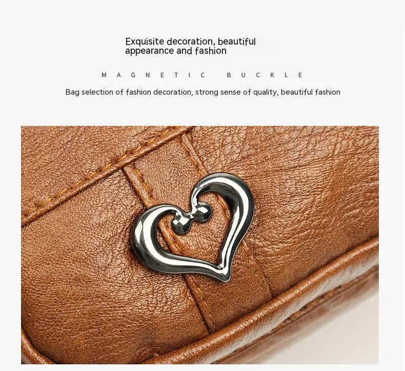 Braune Ledertasche mit herzförmigem Magnetverschluss, modisches Accessoire, elegant.