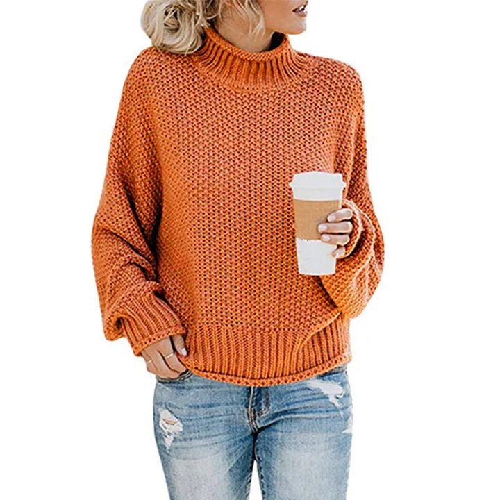 Frau in orangefarbenem Strickpullover mit Kaffeebecher, lässige Herbstmode, Damenbekleidung.