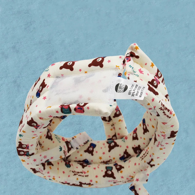 Weißer Baby-Stirnband mit Bärenmuster, Baumwolle, für Neugeborene, Hintergrund blau.