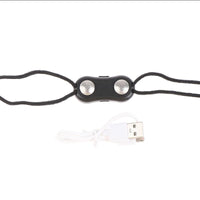 Schwarzes EMS-Gerät mit USB-Kabel, Fitness, Muskelstimulation, tragbar, kompakt.