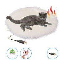 Graue Katze auf weißem, rundem Heizkissen mit USB-Anschluss, ideal für Haustiere.