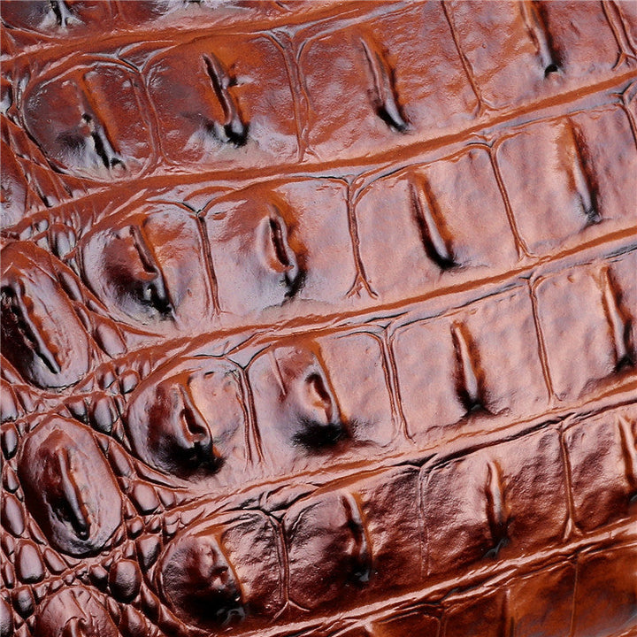 Braunes Krokodilleder, strukturiert, luxuriös, für Taschen und Accessoires, hochwertig.