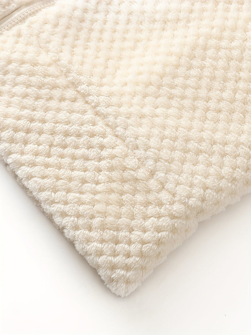 Cremefarbene, flauschige Decke aus weichem Fleece, Nahaufnahme, gemütlich, Heimtextilien.